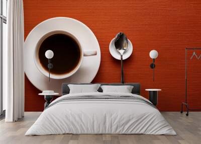 Hot Black Coffee, Top view of a cup of black coffee on a orange burnt background, highlighting the contrast between the dark beverage and the warm, textured surface of hot beverage, food Wall mural