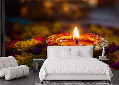 A shining diya intricately designed and glowing warmly is surrounded by vibrant flower petals embodying the festive spirit of Diwali the festival of lights celebrated across India Wall mural