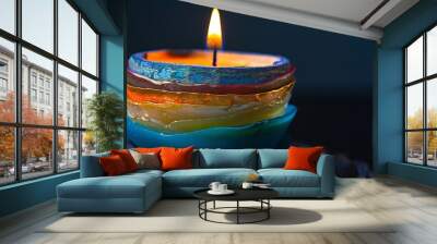 candles isolaed on the background with flowers on the background with text space in the background with candle flames on the candle isolated against  the background of pink and blue and yellow color   Wall mural