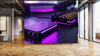 Close-up of RGB external hard drive with purple lights, sleek gaming desk Wall mural