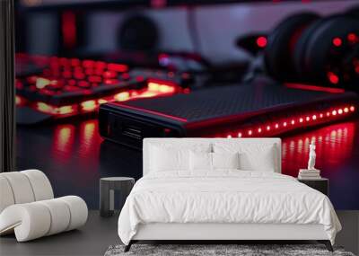 Close-up of RGB external hard drive with red lights, sleek gaming desk Wall mural