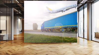 the plane flies over the truck  .  Logistics and transportation Wall mural