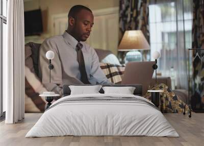 Man Working on Laptop in His Living Room Wall mural