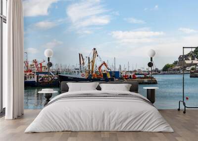 Boats moored up in the harbour in the seaside town of Brixham Wall mural