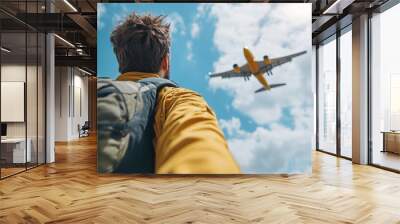 Man watching plane take off. Wall mural