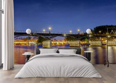 Love Bridge called Pont des Arts on a famous beautiful La Seine river in Paris, France. Best tourists destination in Europe. Taken by long exposure by night photography. Landmark in Paris and historic Wall mural