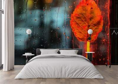 autumn leaf on glass with rain against the background of city lights. Wall mural