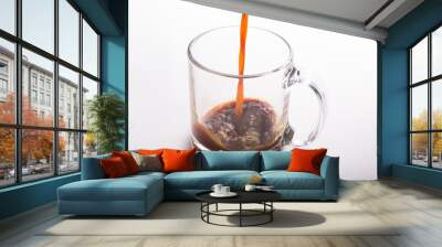 Black Coffee Poured in glass mug on white surface Wall mural