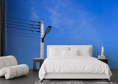 Electric pole with lamp panel, LED, sky background Wall mural