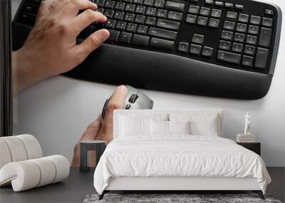 Hands typing on keyboard Wall mural