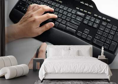 Hands typing on keyboard Wall mural