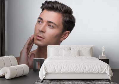 Charming pleasant guy is enjoying his skin Wall mural