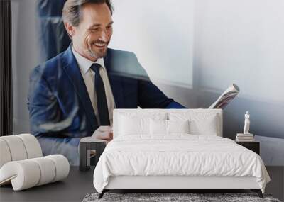 Cheerful businessman drinking coffee in cafe Wall mural