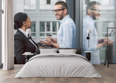 cheerful colleagues having coffee break Wall mural