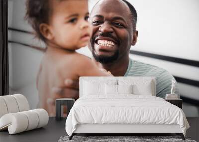 Cheerful father holding cute newborn baby and smiling Wall mural