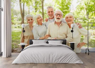 Cheerful mature people standing on the street Wall mural