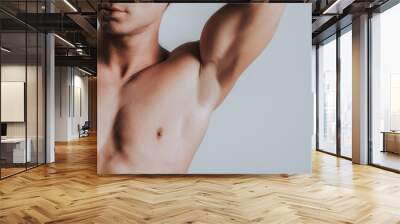 Close up of man showing his armpit while putting arm up Wall mural