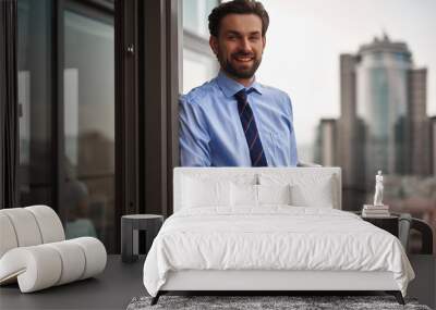 Corporate time-out culture. Waist up portrait of smiling businessman standing on office balcony with cup of coffee while having break Wall mural