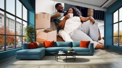 Couple is celebrating housewarming day stock photo Wall mural