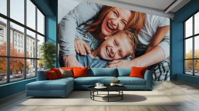 Happy mother and her son embracing together Wall mural