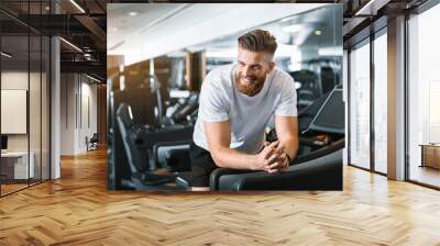 happy smiling man in gym Wall mural