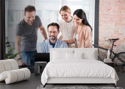 Happy smiling workers in office Wall mural