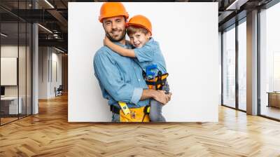 Joyful handyman embracing with son stock photo Wall mural