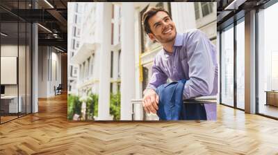 Joyful man enjoying life in city Wall mural