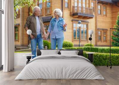 Joyful old couple resting outside Wall mural