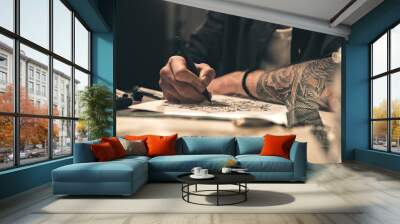 Male painting images at table Wall mural