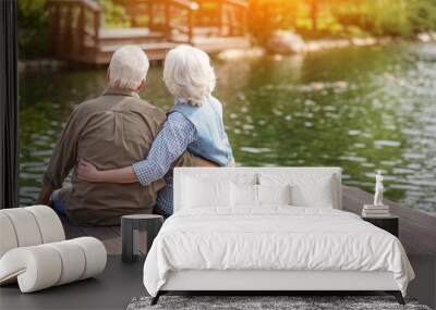 Mature man and woman enjoying nature Wall mural