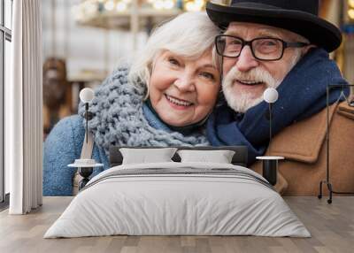 Portrait of joyful senior married couple hugging while relaxing outdoor Wall mural