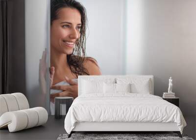 Portrait of satisfied woman with wet hair situating indoor after bath Wall mural