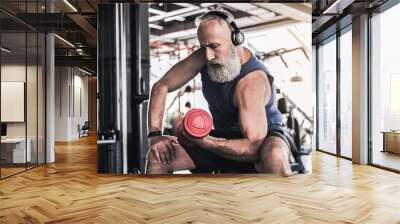 Serious senior male is enjoying sporty lifestyle Wall mural