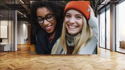 Smiling young girls spending day together outdoors Wall mural