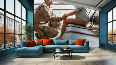 Soldier situating opposite his spouse and promising to come back home alive Wall mural