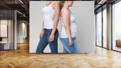 Two women standing together Wall mural