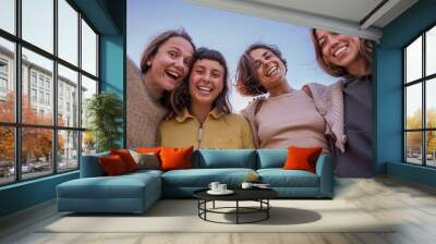 Young people having fun together with self portrait on the summer beach Wall mural