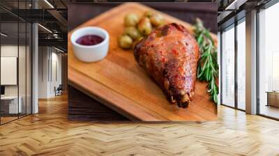 Close up roasted turkey filet with spices, vegetables and jam on wooden board Wall mural