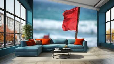 Red warning flag on beach Wall mural