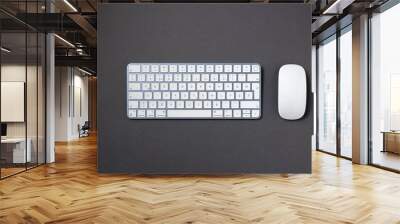 Top view of wireless keyboard and mouse on dark gray work desk Wall mural