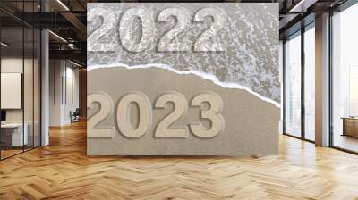 2023 new year concept, sandy beach and foam wave on beige color background. Relaxation mode on the beach concept, copy space. Wall mural