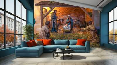 Traditional nativity scene with holy family in bethlehem at Christmas market Wall mural