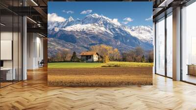 A Rustic Cabin Against Majestic Mountains Wall mural