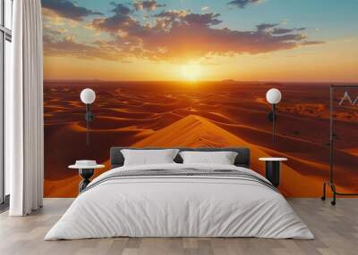 A desert landscape with a sun setting in the background Wall mural