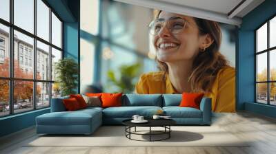 Smiling Woman Wearing Glasses in a Modern Office Setting Wall mural