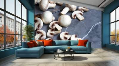 Sliced mushrooms champagne and knife on grey background Wall mural