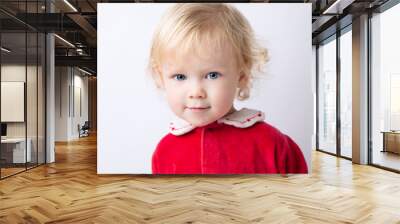 Portrait of cute cute baby girl 1.5 years old, in red clothes close-up on a white light background. concept christmas Wall mural