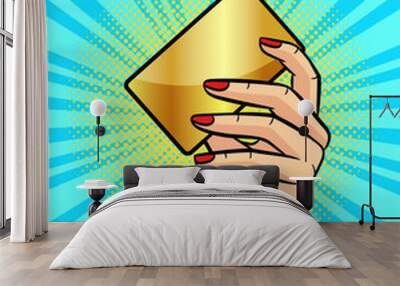 color vector illustration in pop art style. female hand holding a golden plastic card. hand of a bus Wall mural