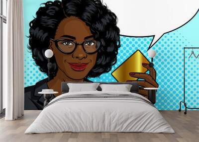 Color vector pop art style illustration. African American business woman holding a gold card in her hand. Lady in an office suit with a credit card in hand. Advertising poster woman with a bank card Wall mural